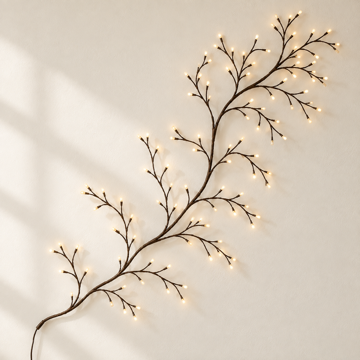 WillowGleam decorative branch light mounted on a cream wall